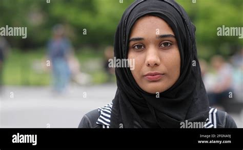 Young Muslim Woman Wearing Hijab Face Portrait Serious Sad Stock Video