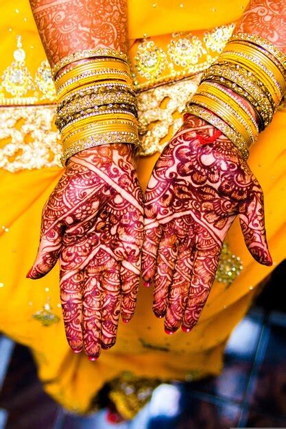 premium photo a woman with henna on her hands