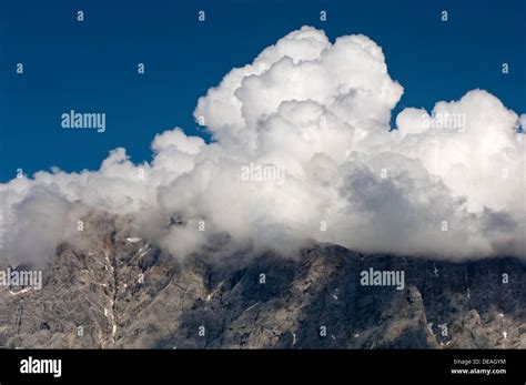 Cumulus Clouds Looming Over A Mountain Ridge Ehrwald Tyrol Austria