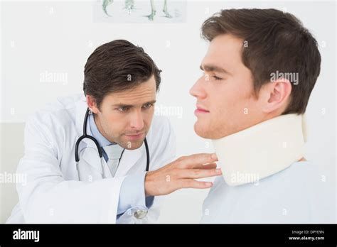 Doctor Examining A Patients Sprained Neck Stock Photo Alamy