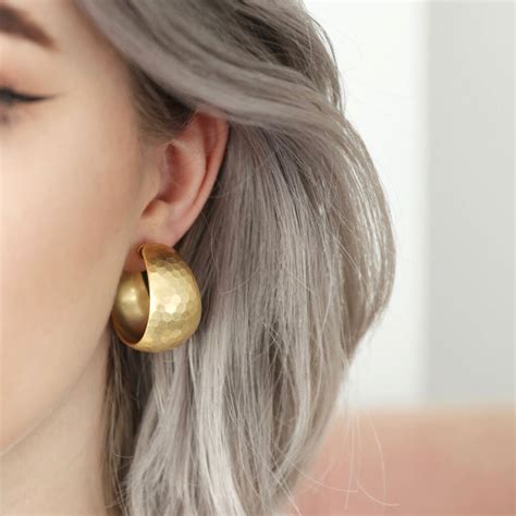 Wide Hammered Hoop Earrings In Gold Plating By Lisa Angel