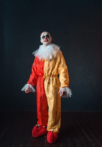 Premium Photo Mad Bloody Clown With Makeup In Carnival Costume Crazy