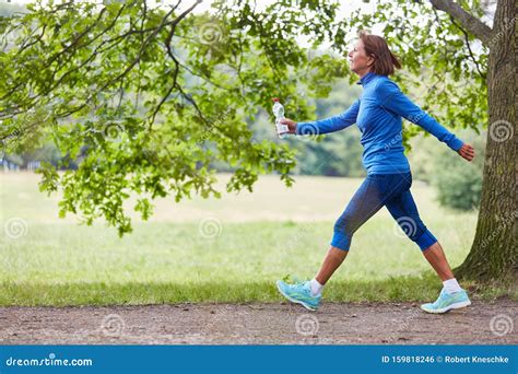 Vital Senior Woman Walking In Nature Stock Photo Image Of Fitness