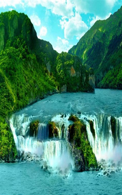 An Artistic View Of A Waterfall In The Middle Of Water Surrounded By