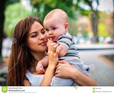 Baby In Park Outdoor Kid On Mom S Hands Stock Photo Image Of Infant