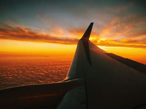Window Plane Photography Of Sunset · Free Stock Photo