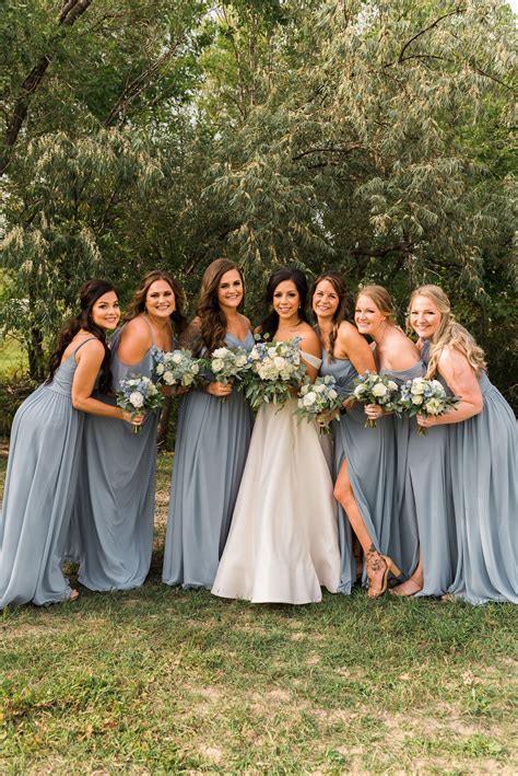 Bride With Bridesmaids In Dusty Blue Bridesmaid Dresses Blue Themed