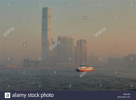 Sunrise Over Victoria Harbour Hong Kong With Ferrys Crossing And The