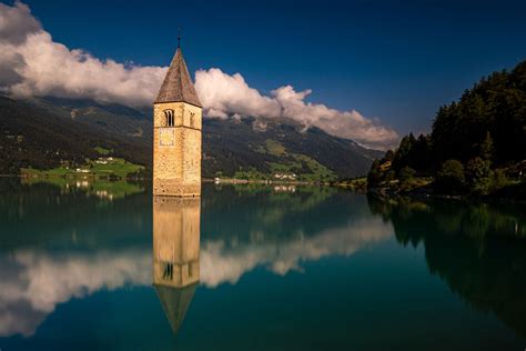Submerged Church Tower Of Graun Lake Reschenresia Italy