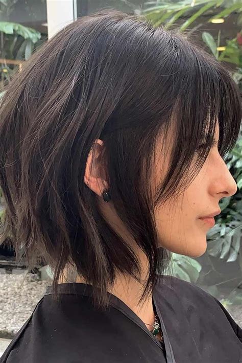 The individuality and originality is expressed by these hairstyles. Black Choppy Bob With Center Parted Bangs #choppybob #bobhairstyles #bobhaircuts #hairstyles in ...