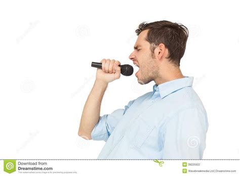 Men Singing Side View Of A Young Man Singing Into Microphone Over