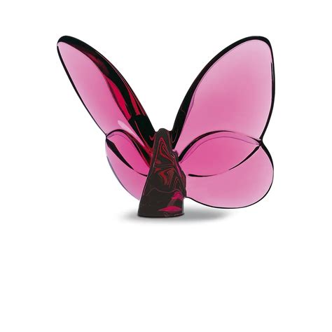 A Pink Butterfly Sculpture Sitting On Top Of A White Surface