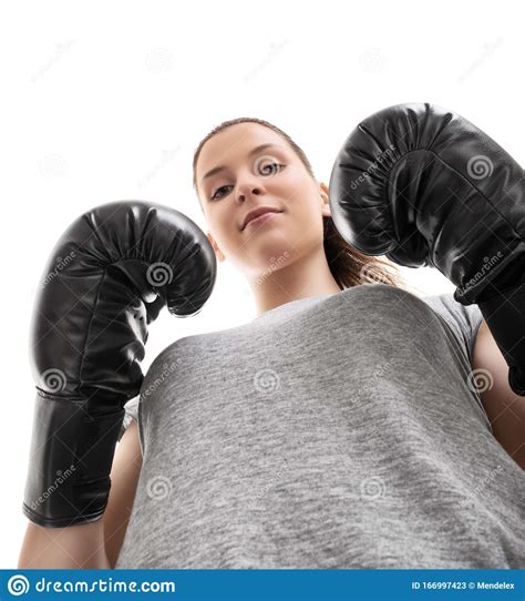 Bottom Up View Of A Beautiful Young Woman With Boxing Gloves Stock