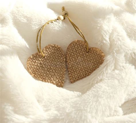 Two Burlap Hearts On White Fur Plaid Folds Light And Shadow Concept