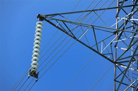 High Voltage Power Lines And Insulator Closeup Stock Photo Download