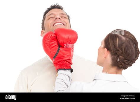 Businesswoman Wearing Boxing Gloves Punching Businessman Stock Photo