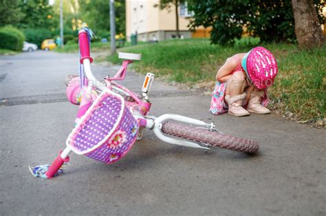 The Child Fell From A Bicycle And Cries The Concept Of Childhoo Stock