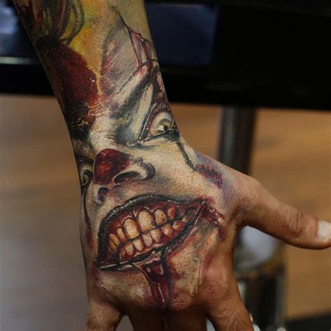 A tiny and minimal tattoo of grim reaper would look equally cute and scary. Scary Clown Hand Piece | Best tattoo design ideas