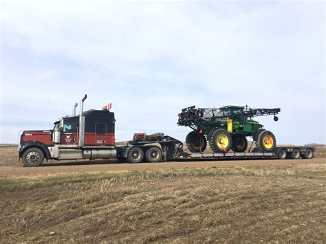 Farm Equipment Hauling Lowdermilk Transport