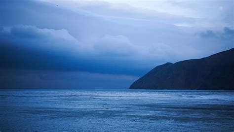 Landscape Photography Of Ocean Under Nimbus Clouds Lynmouth Landscape