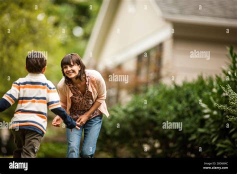 Young Boy Runs To His Mother Stock Photo Alamy