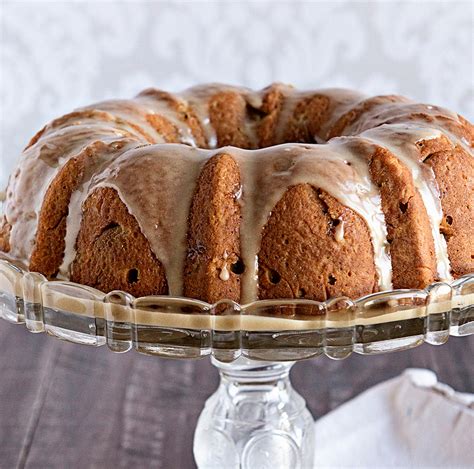 Christmas bundt cake with icing and holly decorations. Apple Spice Walnut Cake with Caramel Icing - Better Baking BibleBetter Baking Bible