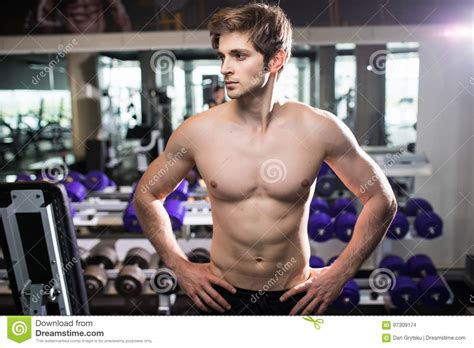 Muscular Man Working Out In Gym Doing Exercises At Triceps Strong Male