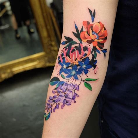 Floral Tattoo On The Right Arm