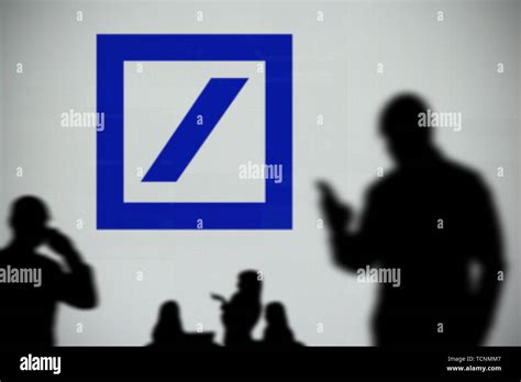 The Deutsche Bank Logo Is Seen On An Led Screen In The Background While
