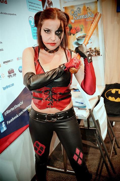 A Woman Dressed In Costume Holding A Bat