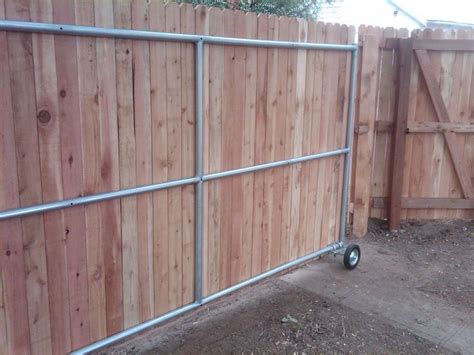 Wood Fence Ideas With A Gate Steel Framed Roll Gate With Wood Finish