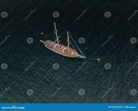 Aerial Shot Of A Two Masted Fishing Boat Sailing In The Sea Dunes Stock