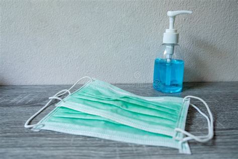 Picture Of Medical Surgical Mask And Alcohol Hand Sanitizer Wash Dirt