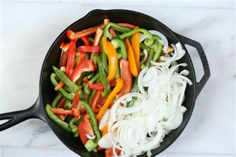 You'll need a fairly large skillet, at least 12 inches or larger, to handle the chicken and all the vegetables. Easy Chicken Fajitas Recipe | A Farmgirl's Kitchen