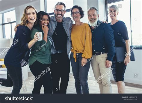 Cheerful Business People Standing Together And Laughing Team Of
