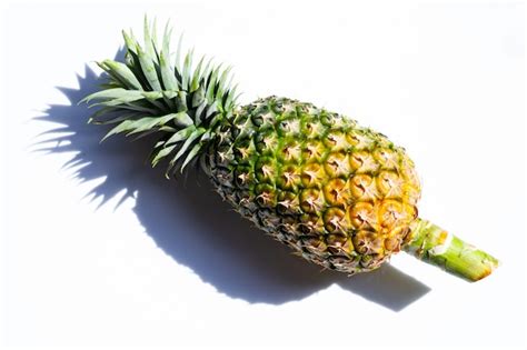 Premium Photo Single Whole Pineapple On White Surface
