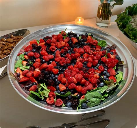 Mixed Green Salad With Fresh Berries And Praline Pecans Catering By