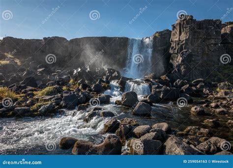 Beautiful Oxararfoss Waterfall Coming Down A Cliff And Hitting Big