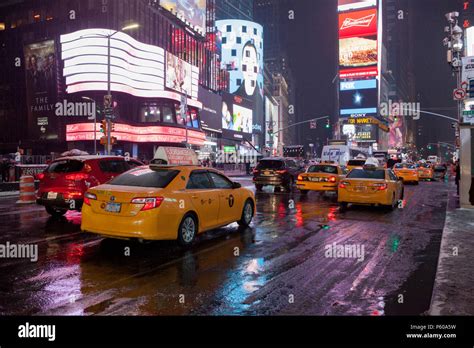 New Yorks Famous Yellow Cabs On A Rainy Winters Evening In Midtown Manhattan New York City