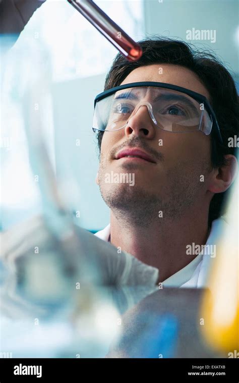 Scientist Conducting Experiment In Laboratory Stock Photo Alamy