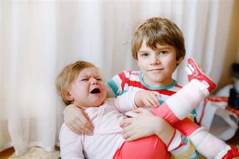 Sister Comforting Crying Brother Stock Photos Free And Royalty Free