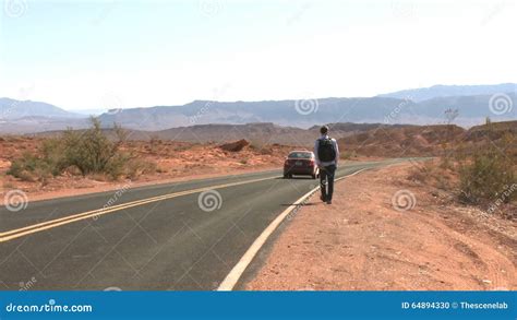 Hitchhiker On A Desert Road 2 Of 2 Stock Footage Video Of Rock
