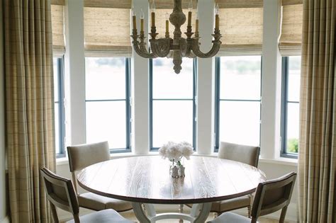 A standard height dining room table is a classic for good reason. Round Dining Table with Gray Dining Chairs - Transitional - Dining Room
