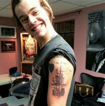 Harry's left wrist features a small key. "Harry Styles never loved Taylor Swift" says his ...