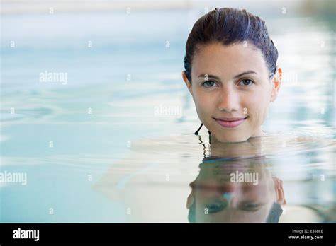 Woman Relaxing In Swimming Pool Portrait Stock Photo Alamy