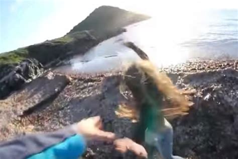 Boyfriend Pushes Girl Off Ridge In Shocking Clip Then Gives Thumbs Up