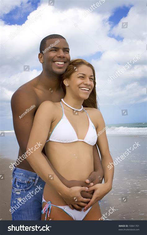 Happy Interracial Couple On A Beach Stock Photo Shutterstock