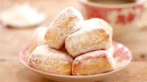 These Baked Homemade Beignets Covered With Powdered Sugar Are