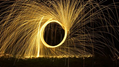 Download Wallpaper 1366x768 Fire Glow Sparks Long Exposure Tablet