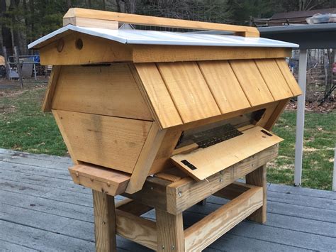 Bees getting ready to swarm on a top bar hive. New Cathedral Top Bar Hives!!